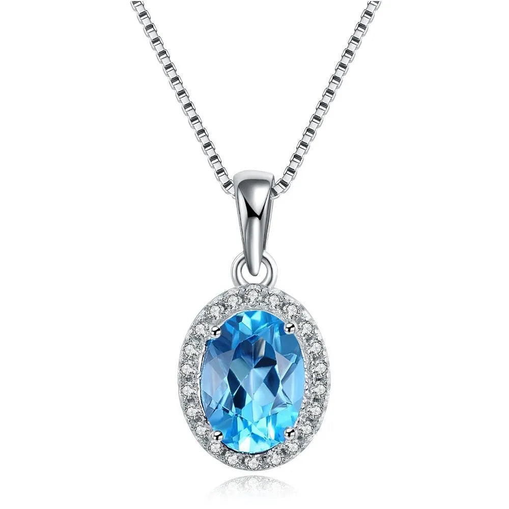 925 sterling silver geometric jewellery set with blue topaz gemstones including earrings, ring, pendant and necklace