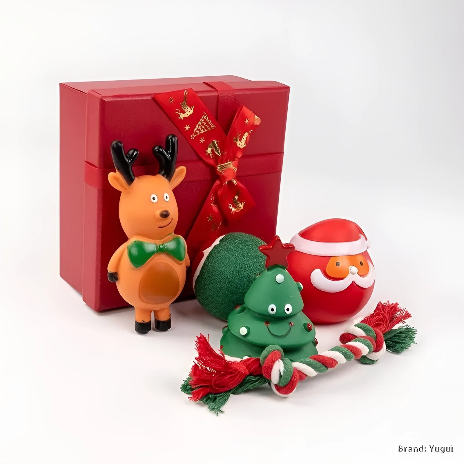 A set of red, green, and white vinyl Christmas dog toys including a Santa head, bite rope, and tennis ball.