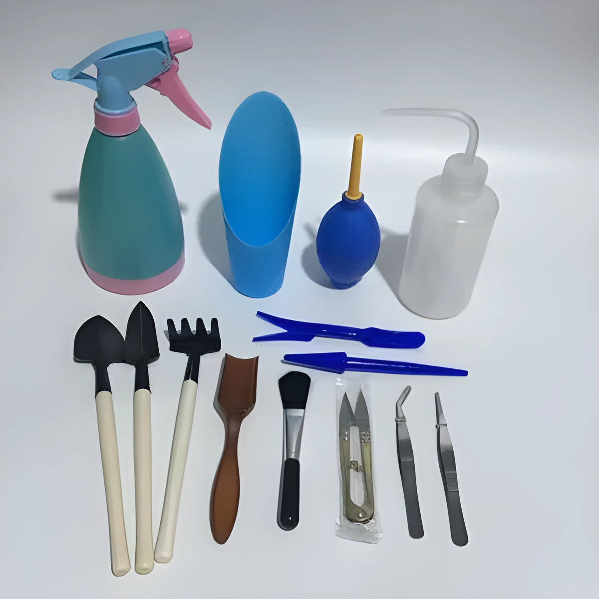 14-piece succulent gardening tool set with watering can mini shovel rake and tweezers on white background