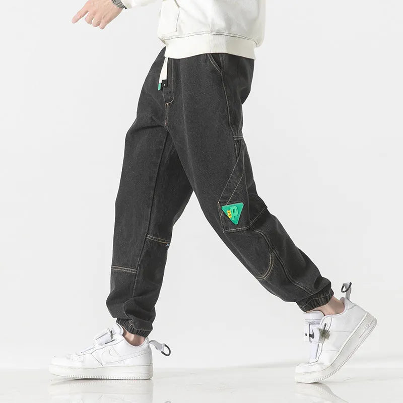 Men's loose-fit tapered cotton trousers in black, blue, or grey colours with mid waist design