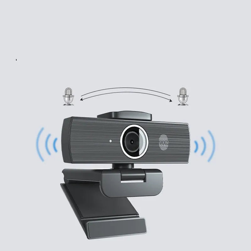 Black USB webcam on a desk with a detached magnetic privacy cover and a 1.7-metre cable