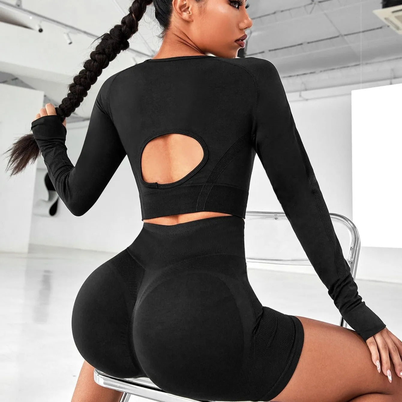 Women's black high waist yoga suit set with long sleeve top and trousers for fitness