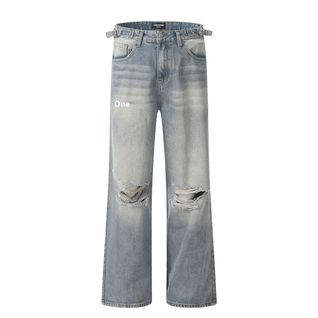 Man wearing blue retro-style straight-leg jeans with a ripped, distressed finish on the legs.