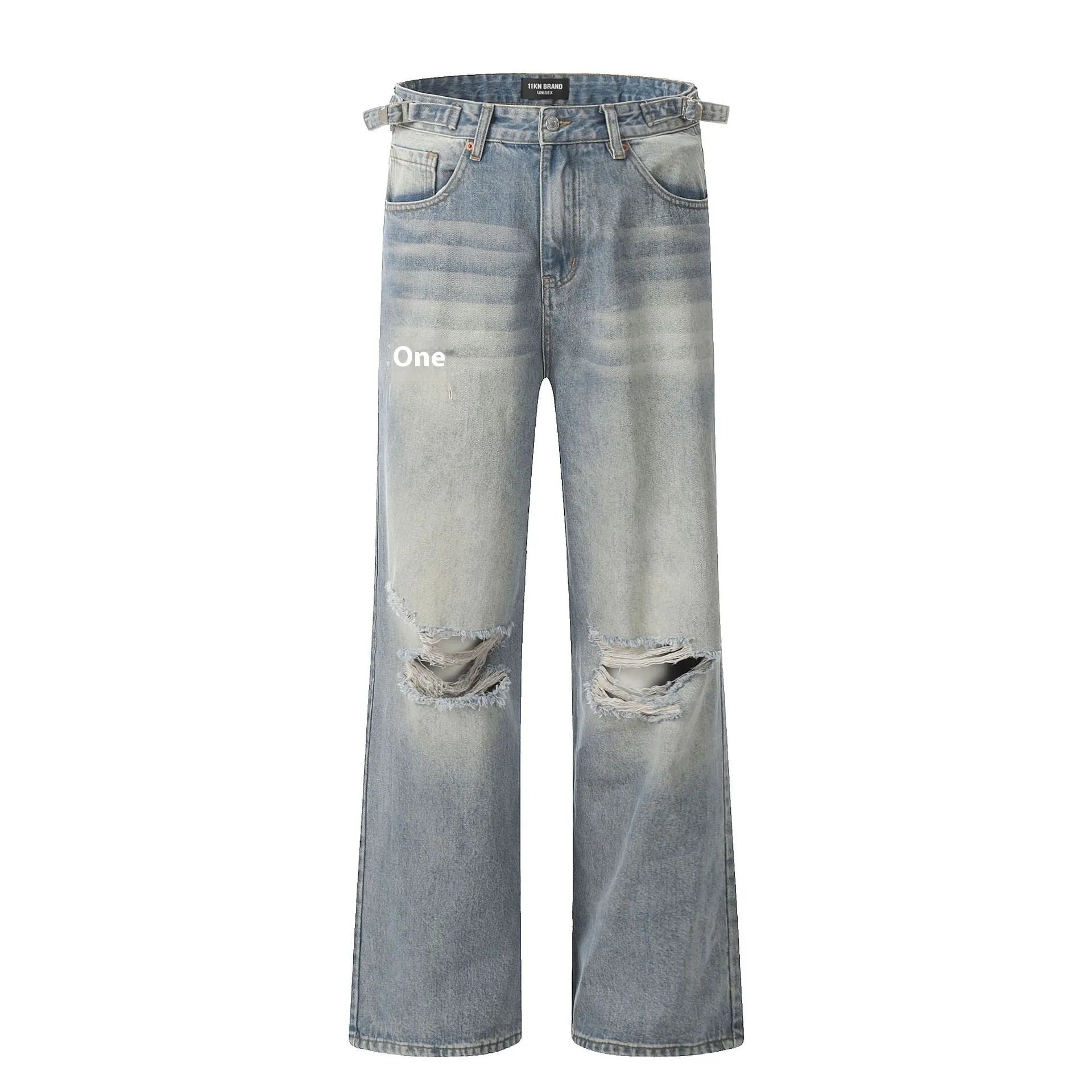 Man wearing blue retro-style straight-leg jeans with a ripped, distressed finish on the legs.