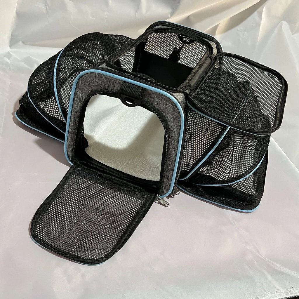 600D cationic cat carrier bag in black with red piping, showing shoulder strap and medium-soft construction