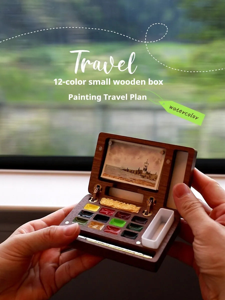 Mini wooden watercolour paint box with walnut finish, showing closed lid.