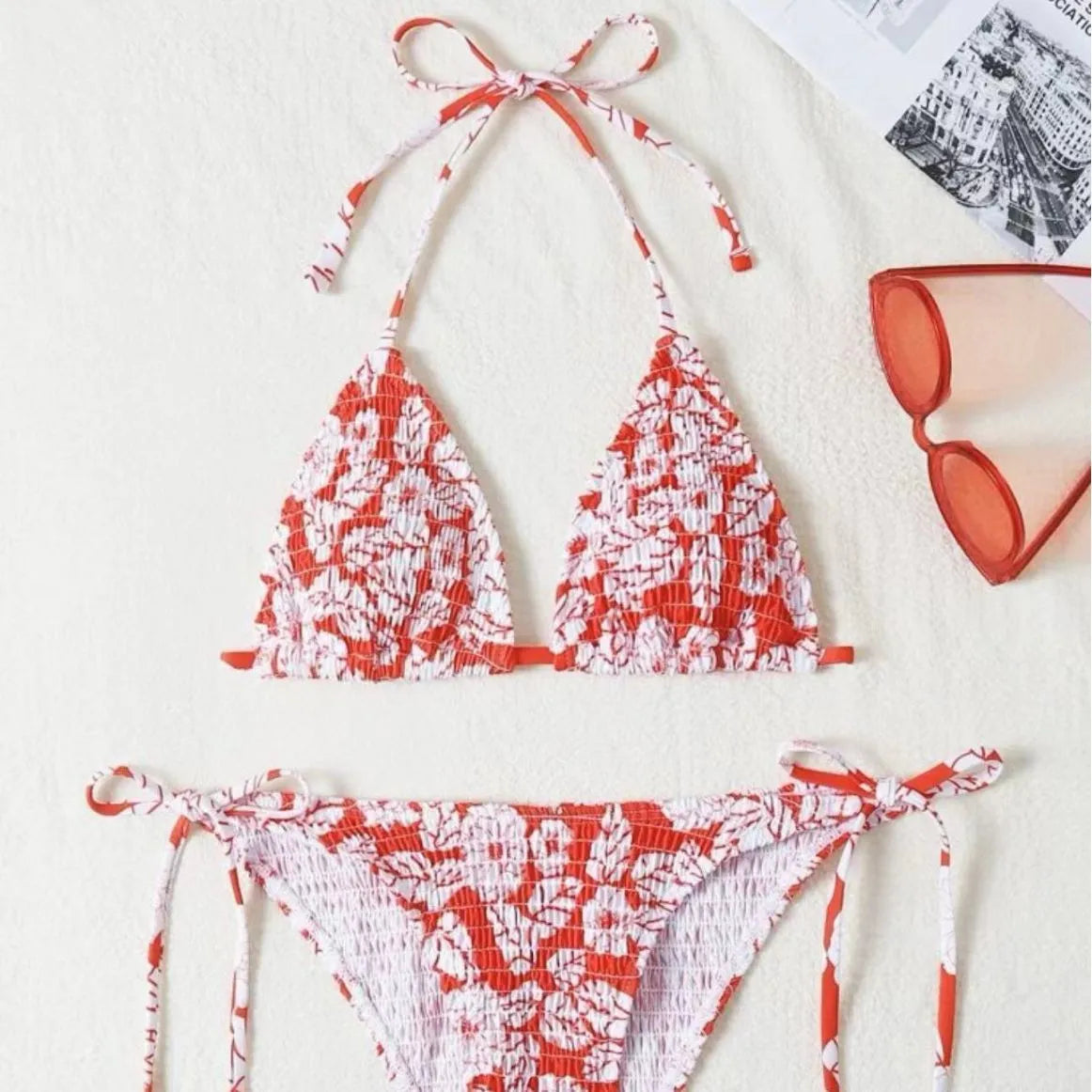 Women's multi-colour halter neck swimsuit bikini set with floral pattern on a mannequin