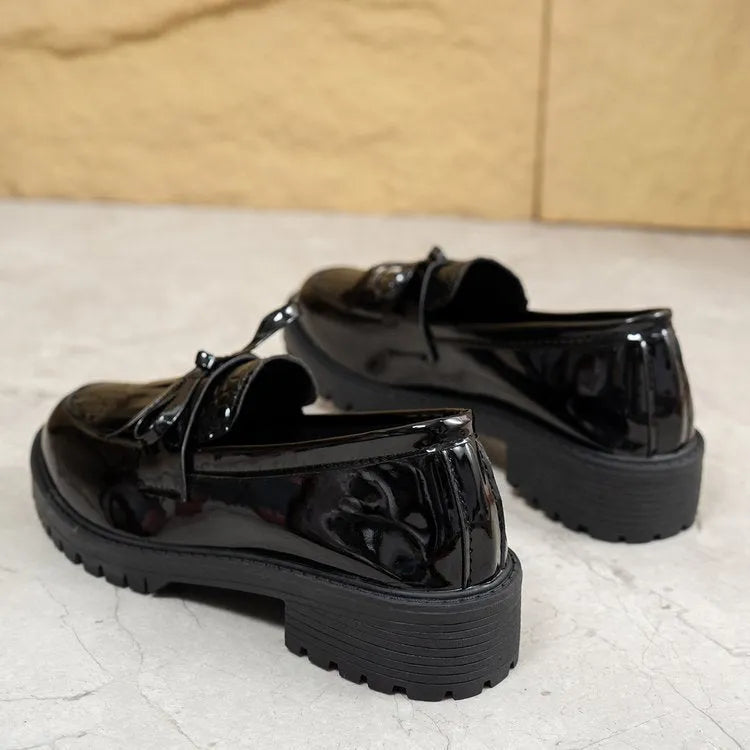 Women's brown and black bow detail loafers made from artificial PU, slip-on style.
