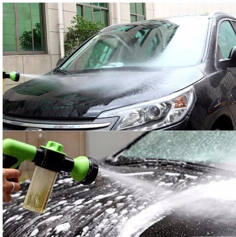 Green high-pressure foam spray gun with adjustable nozzle and attached water hose for car and garden cleaning.