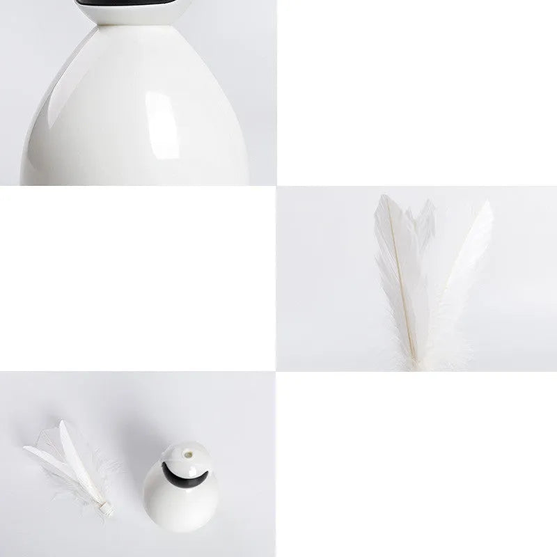 ABS tumbler cat toy with feather replacements, available in white, yellow, and pink
