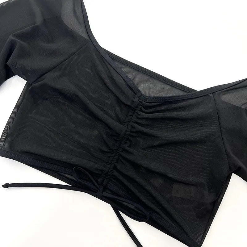 Black mesh four-piece women's bikini set with long sleeves and briefs bottom