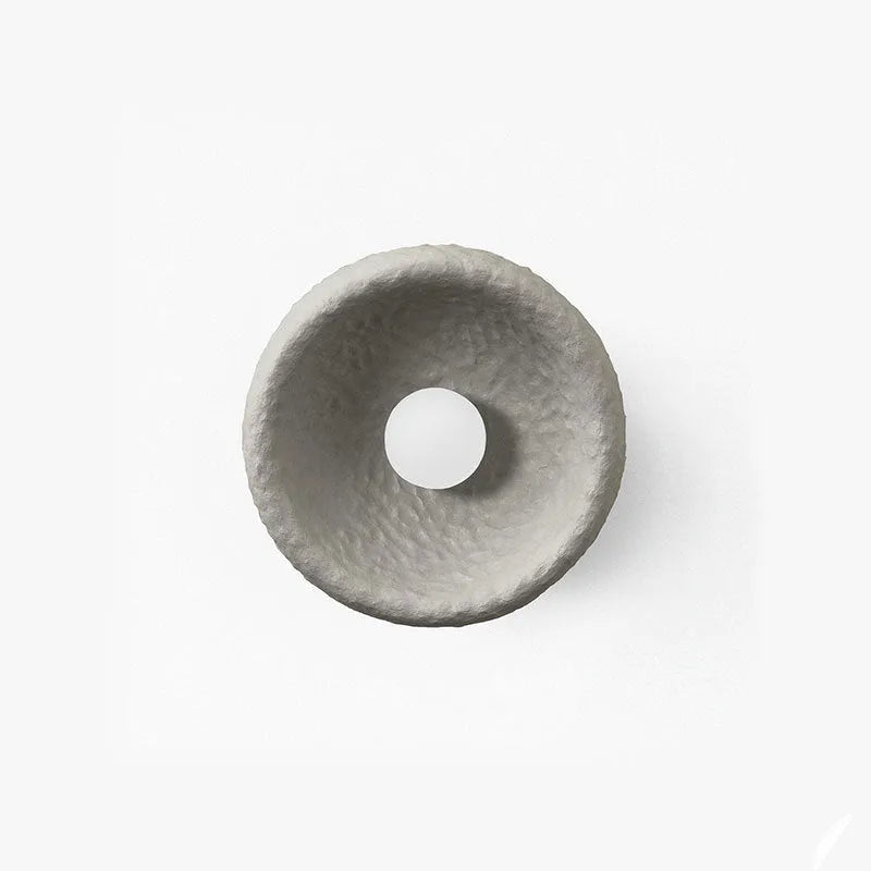 Japanese-style simple silent wall lamp with a white resin shade in three size diameters.
