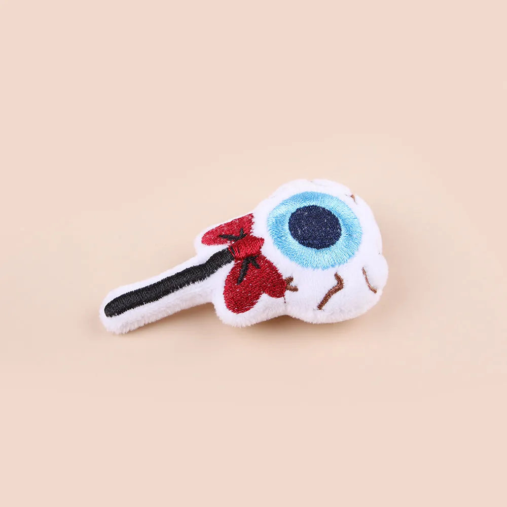 Plush cat teaser wand with colourful pom-pom attachment in candy pink design