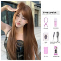 Warm brown long straight synthetic wig with a full fringe on a model.