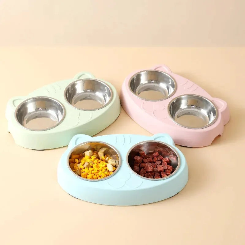 Blue plastic double bowl pet feeder tray for cats and small dogs on a floor.
