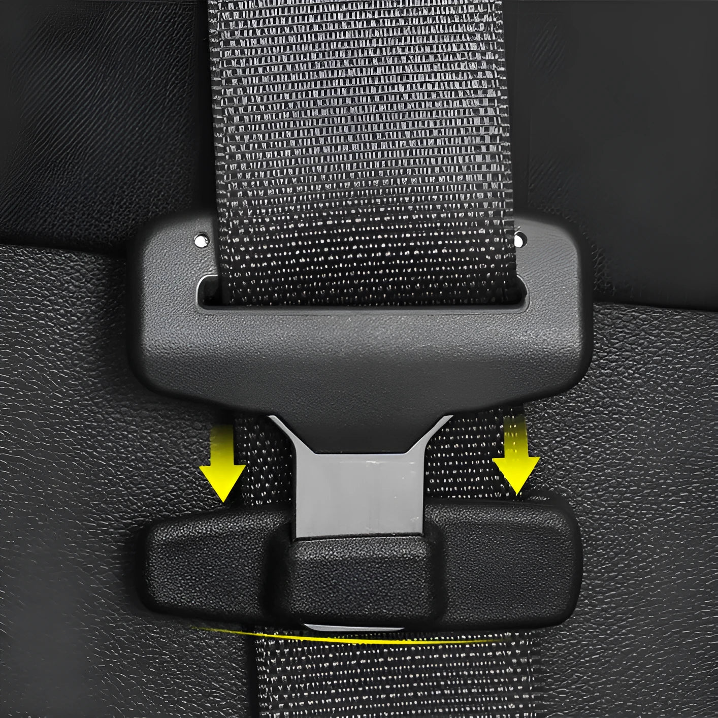Two black ABS plastic universal car seat belt stopper clips on a grey background.