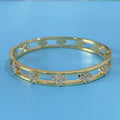 Gold and silver women's hollow bracelets with a four-leaf clover charm and zircon detailing.