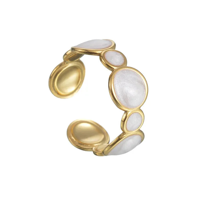 A geometric-shaped adjustable ring made from stainless steel with an electroplated metallic finish.