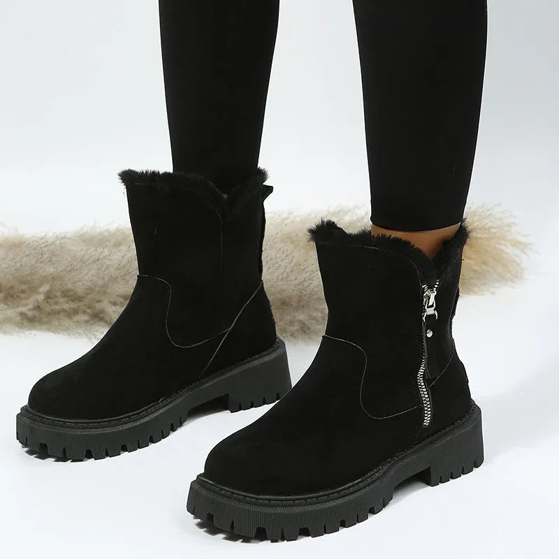 Women's black high-top faux suede snow boot with side zipper and non-slip sole.