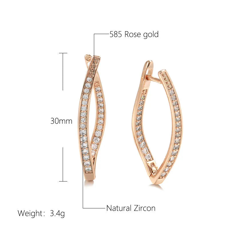 A pair of geometric drop earrings with a clear zircon stone and copper posts, colour H0493.