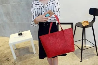 European-style women's shoulder bag handbag in simple design, shown in black and grey colour options