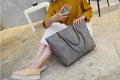 European-style women's shoulder bag handbag in simple design, shown in black and grey colour options