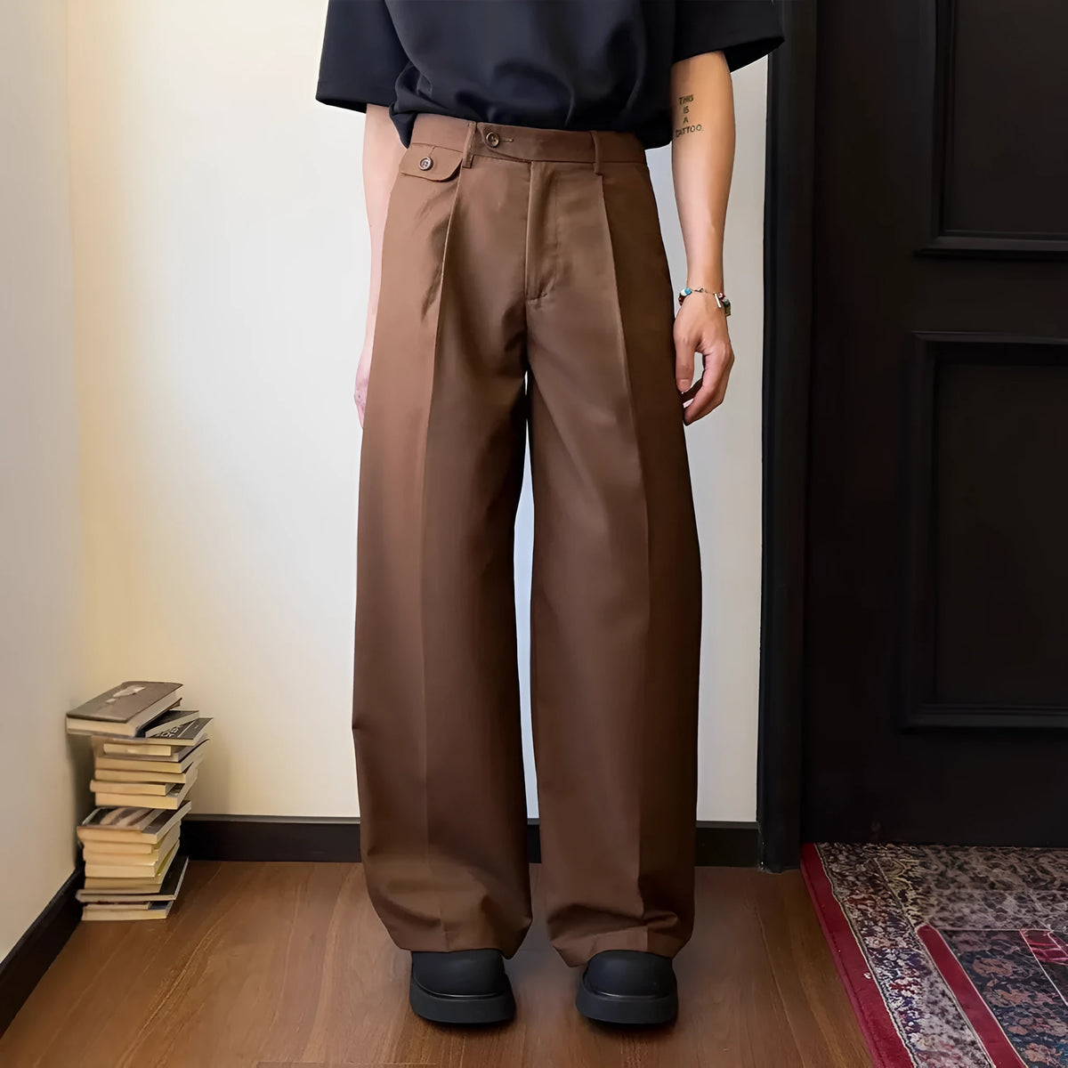 Men's straight-leg suit trousers in brown with wide-leg fit showing front and side views.