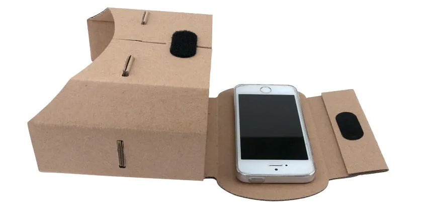 White cardboard virtual reality glasses headset for smartphones with 3D lens viewing.