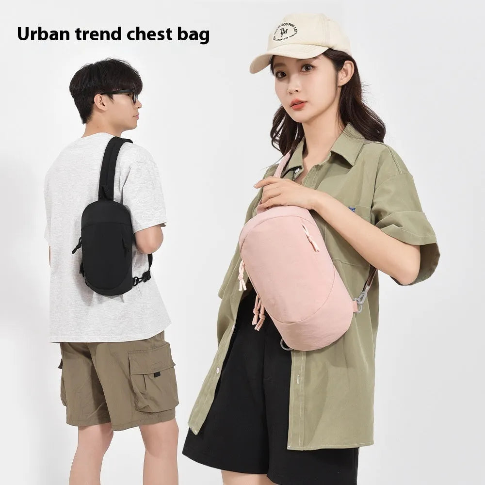 Outdoor crossbody bag in nylon shown in Army Green colour with a visible phone compartment.