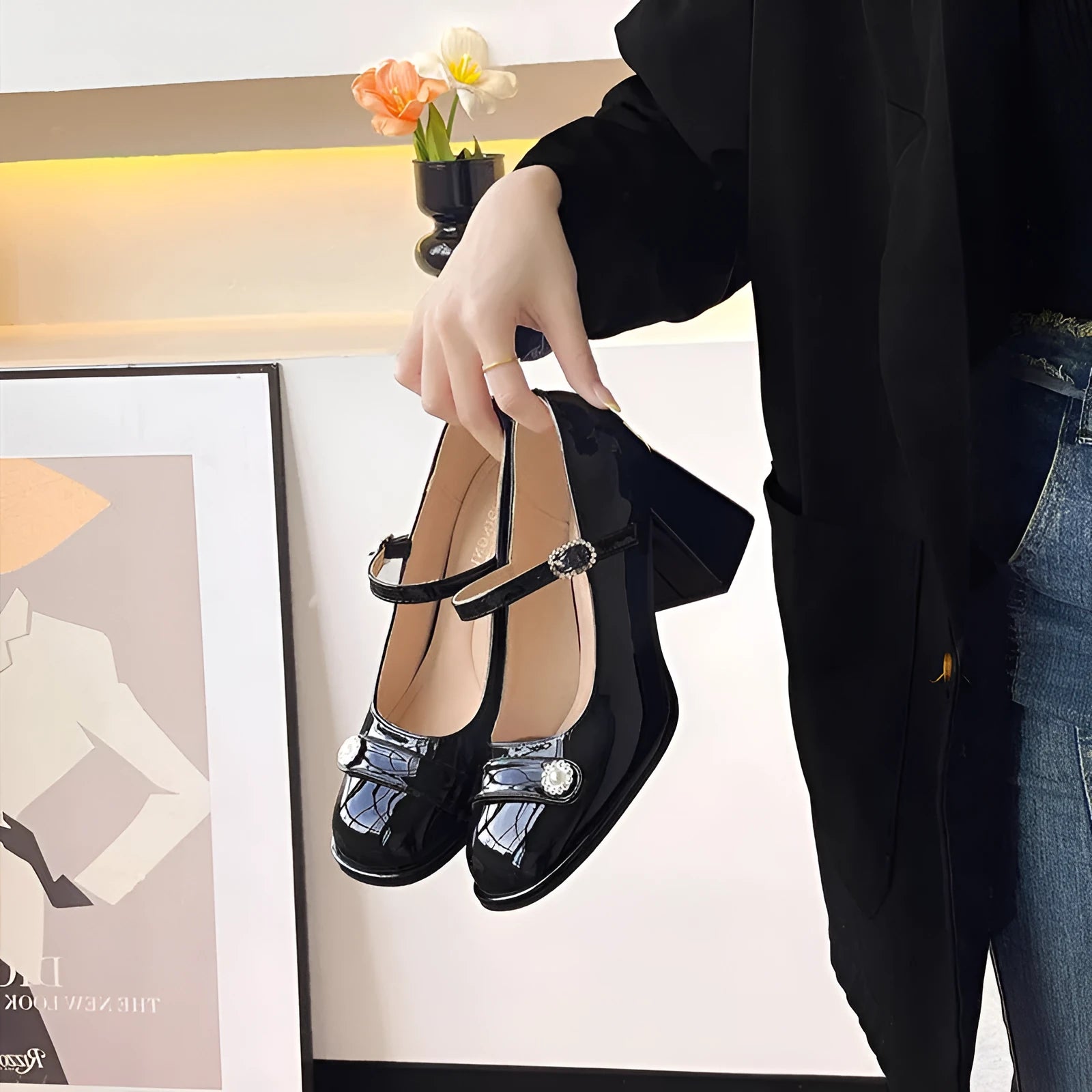 Black patent leather women's chunky heel shoes with round toe and buckle fastening for wide feet
