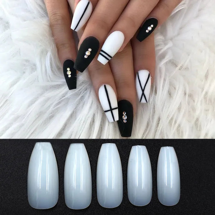 500 clear natural ABS fake nails in various sizes arranged with nail tools