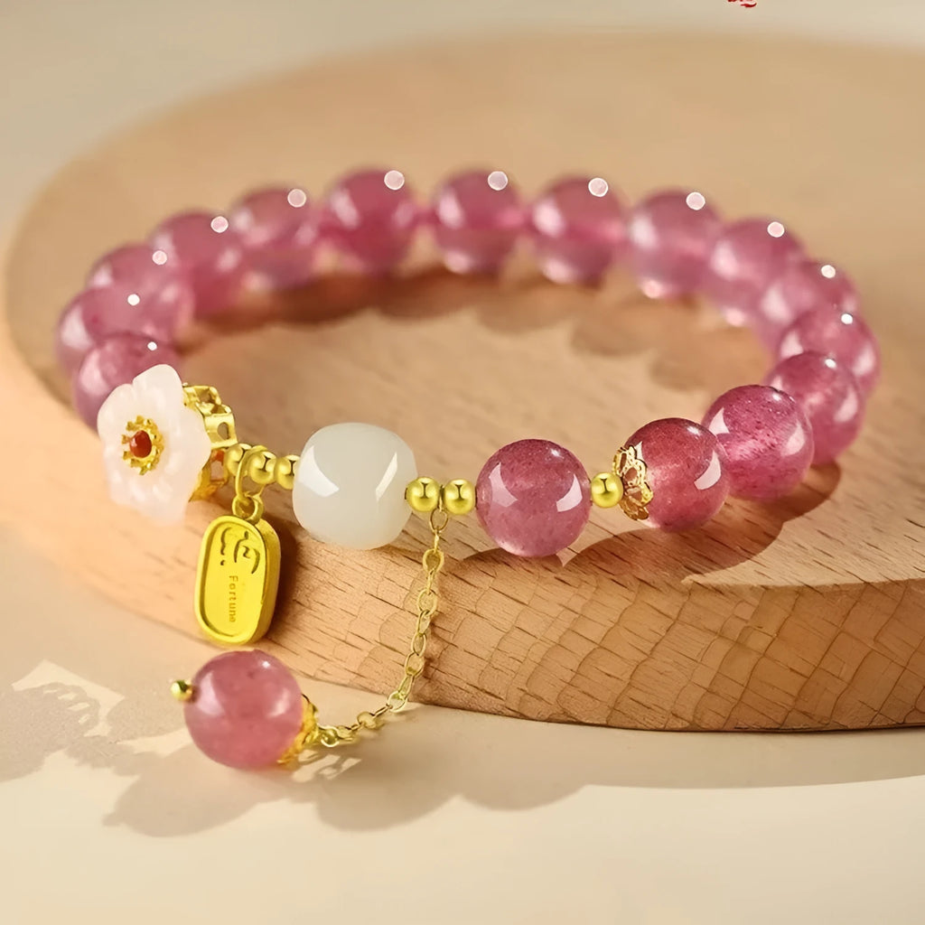 Handmade Hetian jade peach blossom strawberry quartz crystal bracelet for women showing strawberry quartz pearl and charm details