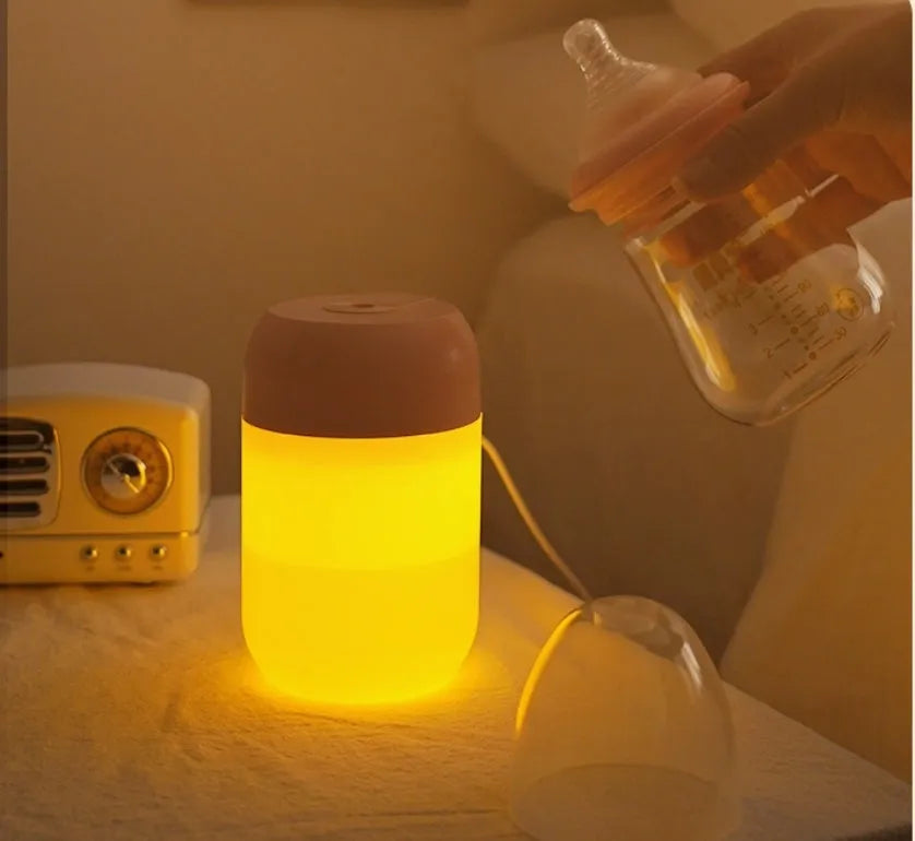 White cylindrical USB-powered mini humidifier with charging cable