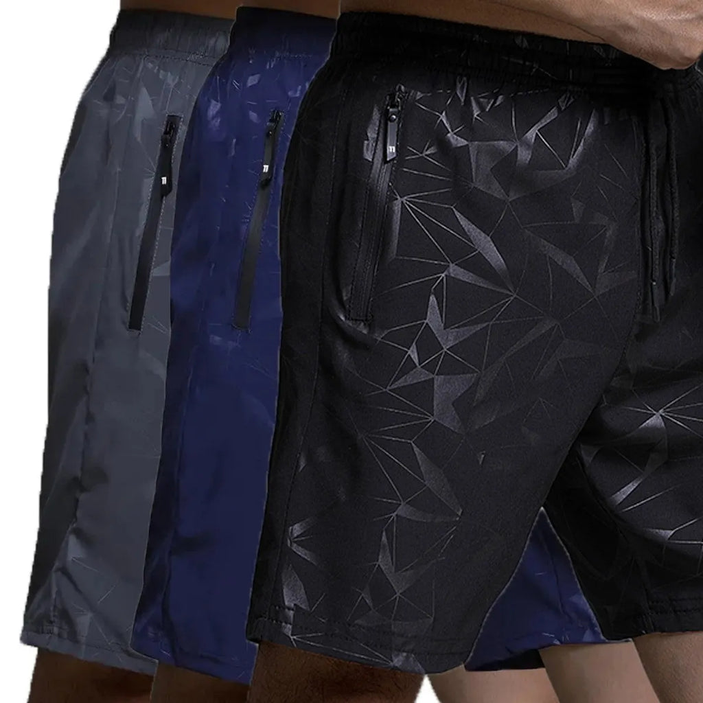 Man wearing loose black sports shorts made of polyester fabric, showing relaxed fit and elasticated waistband.