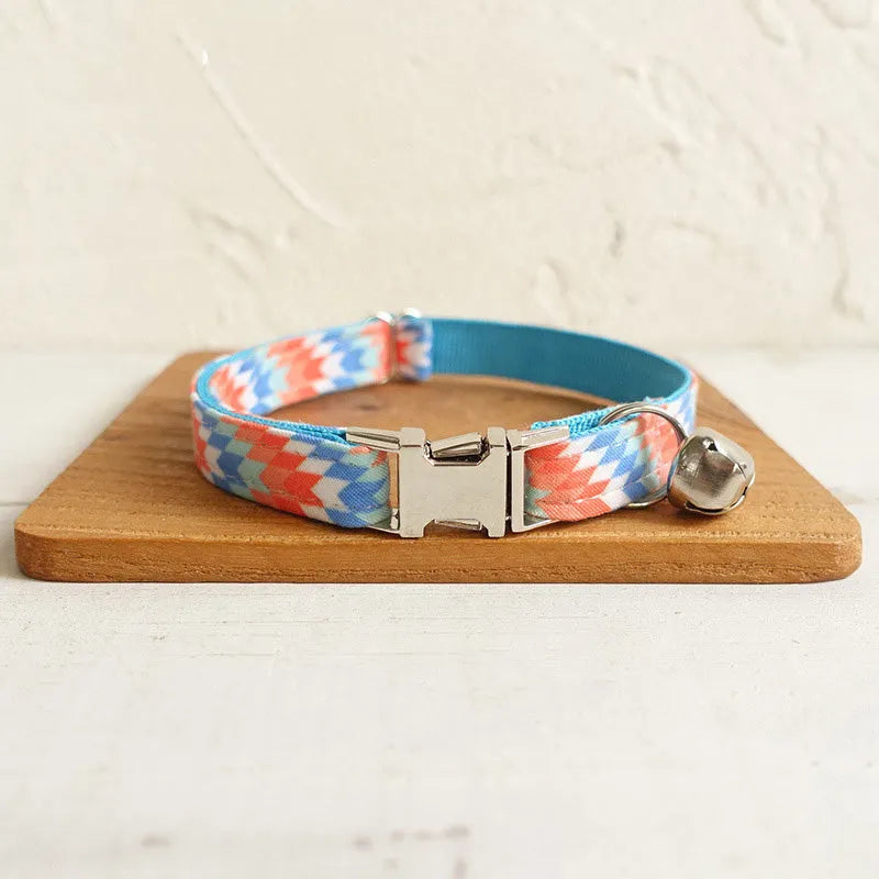 Blue polyester cat collar with printed pattern and lock closure, shown in sizes S and L
