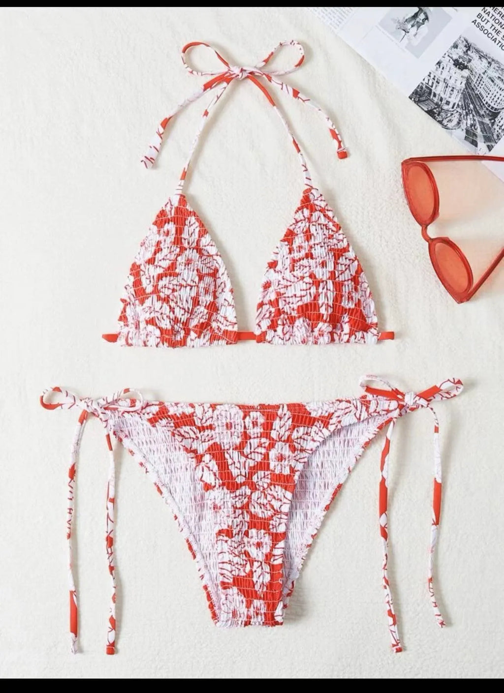 Women's multi-colour halter neck swimsuit bikini set with floral pattern on a mannequin