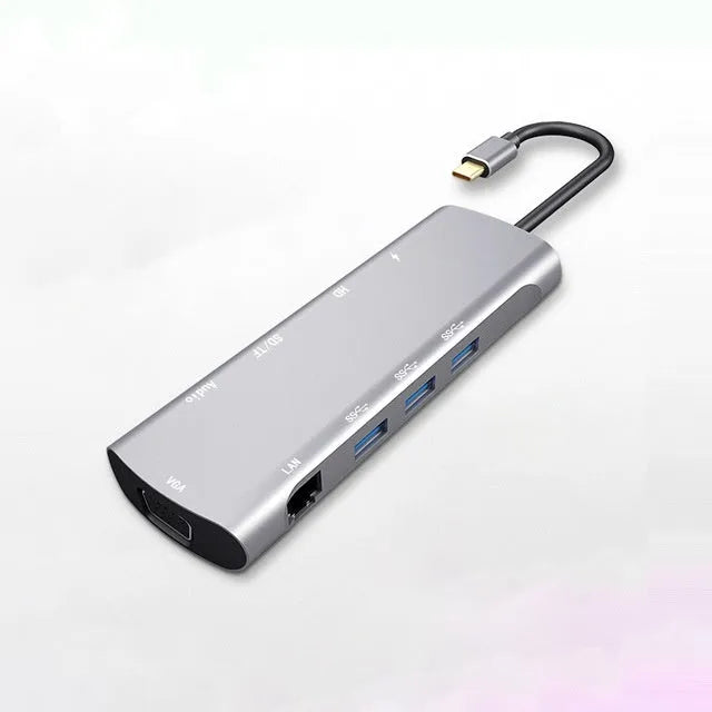 Grey aluminium USB-C docking station with HDMI, VGA, USB ports, and a 140mm cable.
