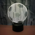3D football night light with acrylic panel on ABS base, showing colourful projection.