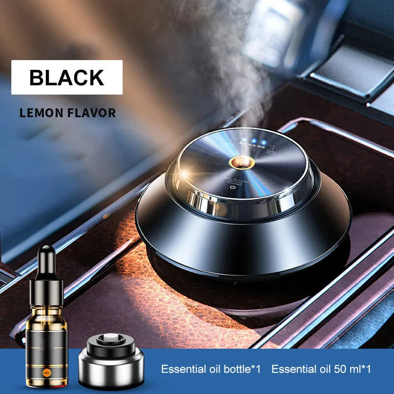Black metal butterfly car aromatherapy air purifier with USB cable and essential oil bottle.