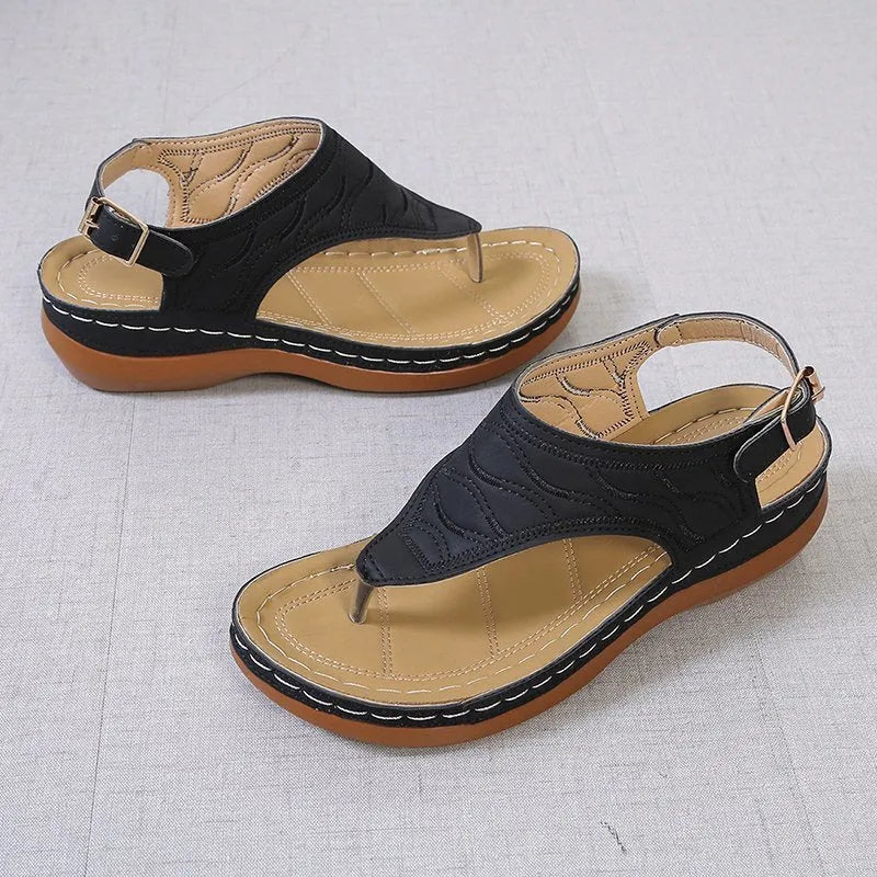Women's casual wedge heel flip flop sandals with an adjustable buckle strap in solid colours.