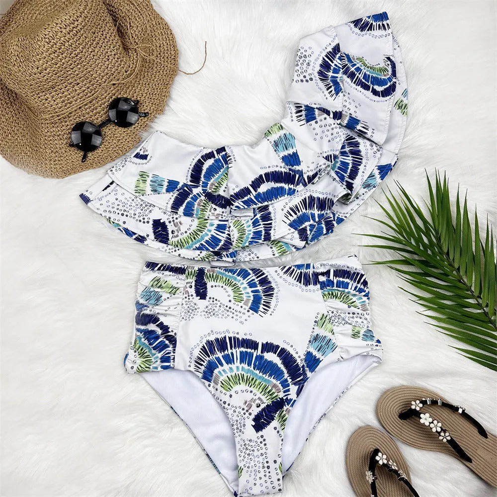 White women's one-shoulder swimsuit with lotus leaf pattern and split skirt design