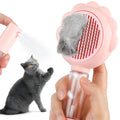 Grey spray cat brush with a release button and stainless steel bristles on a white background.