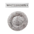 Fluffy donut-shaped dog bed in long plush fabric, showing raised rim and available colour options