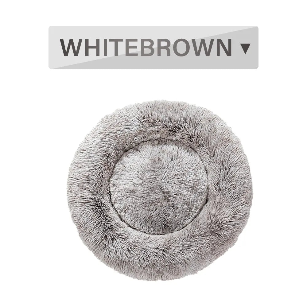 Fluffy donut-shaped dog bed in long plush fabric, showing raised rim and available colour options