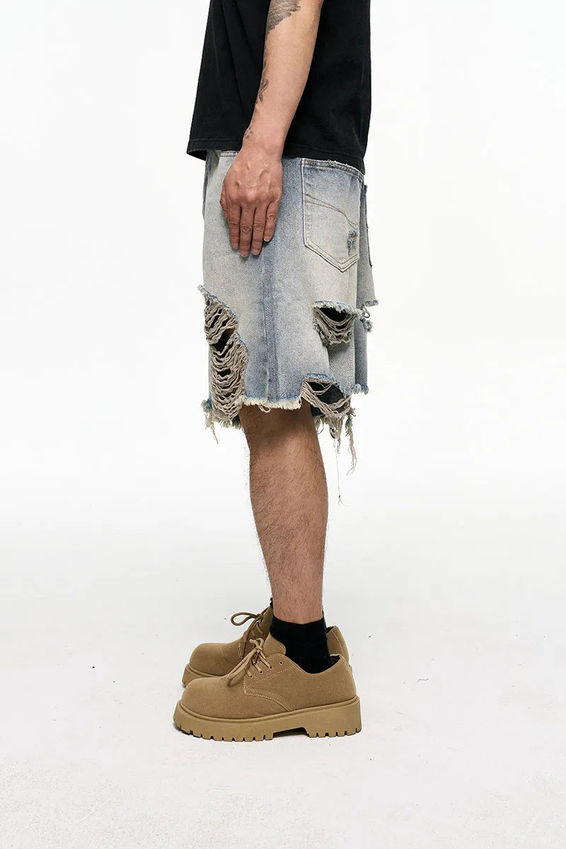 Men's light blue baggy denim shorts with wide legs and retro washed colour.