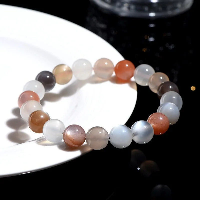 Natural colourful moonlight moonstone bracelet with 8mm beads on wrist.