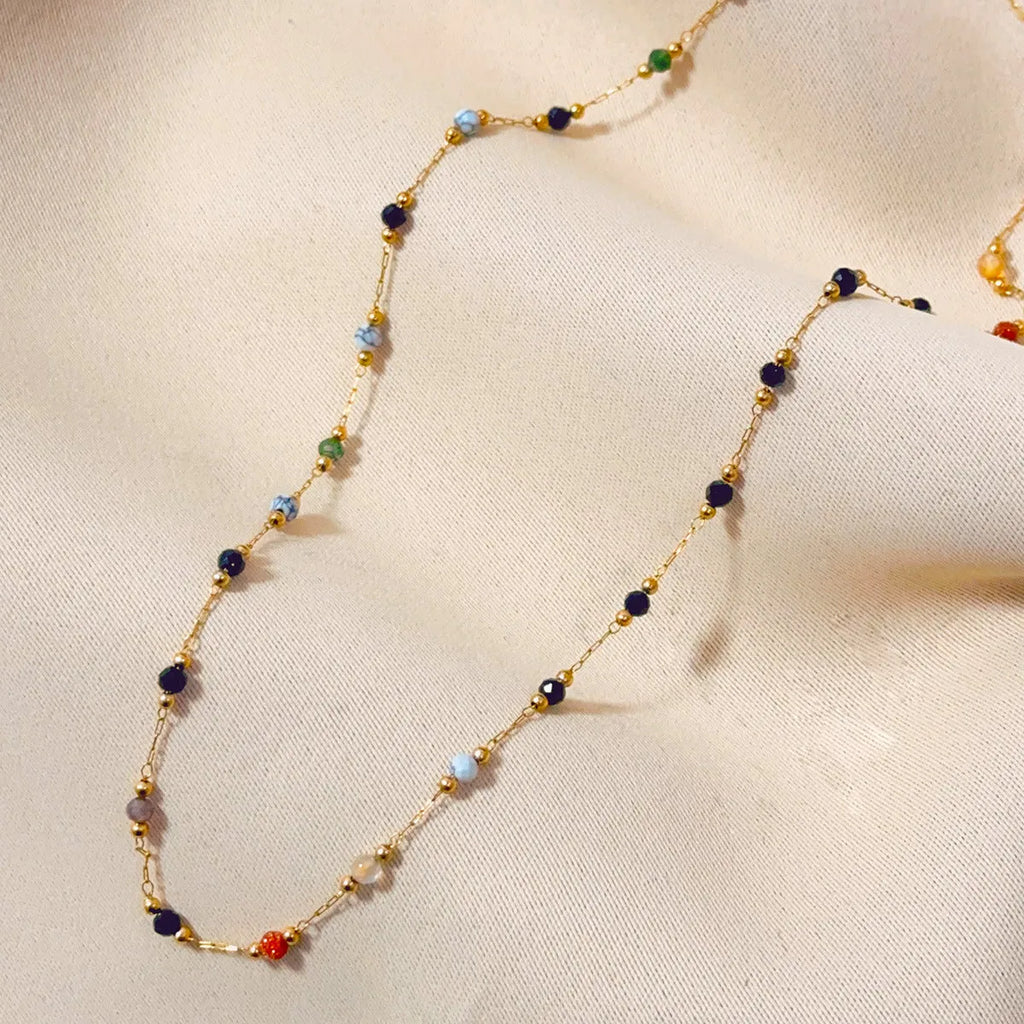 Gold titanium steel women's necklace with a natural stone pendant on an O-ring chain.