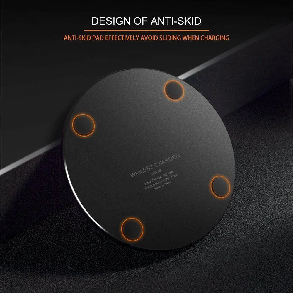 Ultra-thin black square wireless fast charger with USB cable on a table
