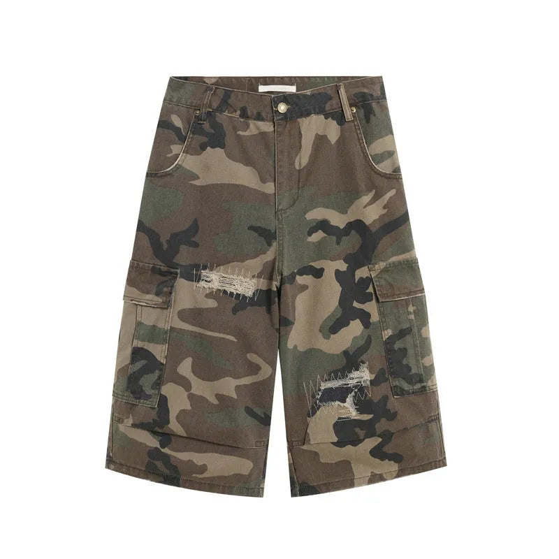 Men's camouflage coloured jeans with patchwork and ripped details, cropped length, straight loose fit.