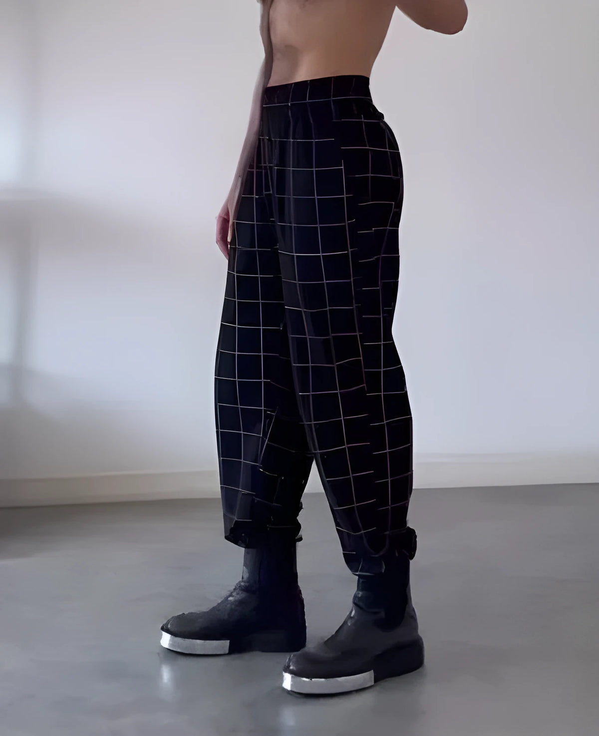 Men's plaid trousers with a removable apron bib featuring two large cargo pockets.